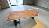 Handcrafted live edge Suar wood dining table measuring 2100 x 1000mm with natural timber grain and optional black steel or solid timber legs.
