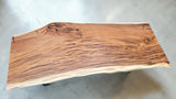 Handcrafted live edge Suar wood dining table measuring 2100 x 1000mm with natural timber grain and optional black steel or solid timber legs.