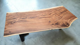 Handcrafted live edge Suar wood dining table measuring 2100 x 1000mm with natural timber grain and optional black steel or solid timber legs.