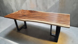 Handcrafted 2300 x 1000mm live edge Suar wood dining table with black steel legs.