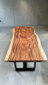 Top view of handcrafted live edge Suar dining table showcasing flowing natural grain and organic timber patterns