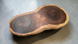 Perspective view of premium Suar coffee table highlighting natural organic shape and handcrafted finish.