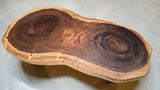 Top view of one-piece Suar timber coffee table featuring dramatic natural growth rings.