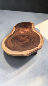 Natural edge solid Suar timber coffee table with twin circular grain patterns viewed from above.