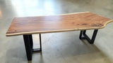 Handcrafted live edge Suar wood dining table measuring 2100 x 1000mm with natural timber grain and optional black steel or solid timber legs.